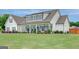 Beautiful two-story home with a wide front porch, blue shutters, and meticulously maintained landscaping at 17 Sawtooth Oak Dr, Moreland, GA 30259