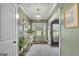 Charming foyer with light green walls, white trim, and decorative accents at 17 Sawtooth Oak Dr, Moreland, GA 30259