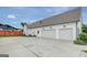 Spacious three-car garage with ample parking space and a well-paved driveway at 17 Sawtooth Oak Dr, Moreland, GA 30259