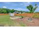 View of the backyard garden with a shed and raised garden beds at 17 Sawtooth Oak Dr, Moreland, GA 30259