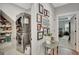 Hallway leads to laundry room and bedroom, decorated with gallery wall, and gray walls at 17 Sawtooth Oak Dr, Moreland, GA 30259