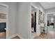 Hallway showcasing powder room, laundry, and primary bedroom at 17 Sawtooth Oak Dr, Moreland, GA 30259