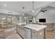 Open concept kitchen with large island, farmhouse sink, and stainless steel dishwasher at 17 Sawtooth Oak Dr, Moreland, GA 30259