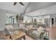 Spacious living room with a sectional couch, open to the kitchen, and a large ceiling fan at 17 Sawtooth Oak Dr, Moreland, GA 30259