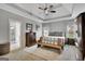 Cozy main bedroom with tray ceilings, natural light, and ensuite bathroom at 17 Sawtooth Oak Dr, Moreland, GA 30259