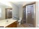 This bathroom features a tiled shower, safety bars, and a neutral color palette at 1017 Ridgefield Dr, Peachtree City, GA 30269