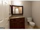 Bathroom boasts granite countertop vanity and tiled tub/shower, providing both style and functionality at 1017 Ridgefield Dr, Peachtree City, GA 30269