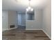 Well-lit dining room boasting hardwood floors and neutral walls, perfect for gatherings at 1017 Ridgefield Dr, Peachtree City, GA 30269