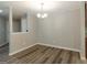 Bright dining room with updated floors, neutral walls, and contemporary lighting at 1017 Ridgefield Dr, Peachtree City, GA 30269