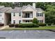 Charming condo with balcony, manicured landscaping, and designated parking spaces at 1017 Ridgefield Dr, Peachtree City, GA 30269