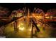 Lit fountain in the middle of a circular pool and clubhouse at 1017 Ridgefield Dr, Peachtree City, GA 30269