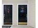 Two adjacent front doors featuring black paint and gold accents in condo at 1017 Ridgefield Dr, Peachtree City, GA 30269