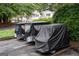 Multiple parked golf carts with covers in a community parking lot at 1017 Ridgefield Dr, Peachtree City, GA 30269