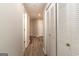 A hallway leading to a bedroom has built-in storage on the right at 1017 Ridgefield Dr, Peachtree City, GA 30269