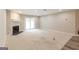 Spacious living room featuring a fireplace, carpeting, and sliding glass doors at 1017 Ridgefield Dr, Peachtree City, GA 30269