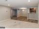 Spacious living room featuring neutral paint, updated flooring, and an open floor plan at 1017 Ridgefield Dr, Peachtree City, GA 30269