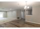 Spacious living room featuring hardwood floors, neutral walls, and modern recessed lighting at 1017 Ridgefield Dr, Peachtree City, GA 30269
