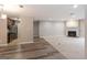 Spacious living room with carpet and wood flooring and a fireplace at 1017 Ridgefield Dr, Peachtree City, GA 30269