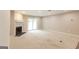 Large carpeted living room with fireplace and slider to patio at 1017 Ridgefield Dr, Peachtree City, GA 30269