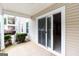 An outdoor patio with a sliding glass door that offers access to a private outdoor space at 1017 Ridgefield Dr, Peachtree City, GA 30269