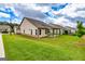 Backyard of home featuring green grass and covered patio at 209 Cottonwood Cir, Peachtree City, GA 30269