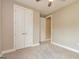 Neutral bedroom with carpeted floors and a closet for storage space at 209 Cottonwood Cir, Peachtree City, GA 30269