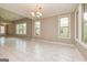 Bright dining room featuring light-filled windows and adjacent exterior door at 209 Cottonwood Cir, Peachtree City, GA 30269