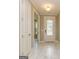 Welcoming foyer with marble tile flooring, decorative front door, and access to adjacent rooms at 209 Cottonwood Cir, Peachtree City, GA 30269
