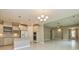 Spacious kitchen showcasing white cabinets and stainless steel appliances at 209 Cottonwood Cir, Peachtree City, GA 30269