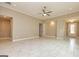 Large living area with tile flooring, neutral walls, and an open layout for versatile furniture arrangement at 209 Cottonwood Cir, Peachtree City, GA 30269
