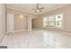 Open-concept living area featuring tile flooring and large windows for natural light at 209 Cottonwood Cir, Peachtree City, GA 30269