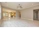 Spacious living room featuring modern tile flooring, neutral color palette, and open floor plan at 209 Cottonwood Cir, Peachtree City, GA 30269