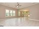 Bright living room with lots of light, a ceiling fan, and elegant tile floors at 209 Cottonwood Cir, Peachtree City, GA 30269