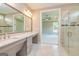 Main bathroom featuring a glass enclosed shower, bedroom view and marble topped vanity at 209 Cottonwood Cir, Peachtree City, GA 30269