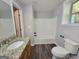 Bathroom with granite countertops, updated fixtures, and a shower/tub combo at 7290 Grayson Dr, Riverdale, GA 30296