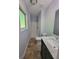 Bathroom featuring a shower, modern vanity, and toilet at 7290 Grayson Dr, Riverdale, GA 30296