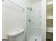 Neat bathroom with a shower stall, toilet, and shelving for storage at 1350 Lori Ct, Conley, GA 30288