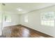 Serene bedroom with hardwood floors, bright windows, and neutral walls creating a calming and inviting space at 1350 Lori Ct, Conley, GA 30288