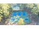 Aerial view of community sports facilities, including tennis and basketball courts nestled among lush greenery at 9178 Lakeview Pkwy, Villa Rica, GA 30180
