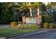 Fairfield Plantation signage surrounded by vibrant flowers and lush greenery, marking the entrance to the community at 9178 Lakeview Pkwy, Villa Rica, GA 30180