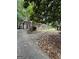 View of a brick home featuring unique arched windows and a long driveway at 2219 Riverbrook Rd, Decatur, GA 30035