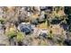 Aerial view of a well-maintained property with a detached garage, stone patio, and lush landscaping at 818 Springdale Ne Rd, Atlanta, GA 30306