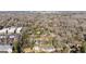 An aerial view showcasing the homes in a wooded suburban neighborhood with lush trees at 818 Springdale Ne Rd, Atlanta, GA 30306