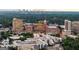 Expansive aerial view of Ponce City Market and the surrounding vibrant Atlanta cityscape with lush greenery at 818 Springdale Ne Rd, Atlanta, GA 30306