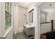 Stylish bathroom featuring a vanity, shower/tub combo, and herringbone tile flooring at 818 Springdale Ne Rd, Atlanta, GA 30306