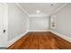Empty bedroom with wood floors, natural light, and neutral paint at 818 Springdale Ne Rd, Atlanta, GA 30306