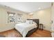 Cozy bedroom featuring large windows, hardwood floors, and a neutral color palette at 818 Springdale Ne Rd, Atlanta, GA 30306