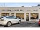 Modern coffee and wine bar exterior with large storefront windows, sleek signage, and convenient parking at 818 Springdale Ne Rd, Atlanta, GA 30306