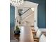 Elegant dining room featuring stylish lighting, a large table, and a view of the staircase at 818 Springdale Ne Rd, Atlanta, GA 30306