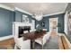 Stylish dining room with a large table, elegant lighting, and sophisticated wall color at 818 Springdale Ne Rd, Atlanta, GA 30306
